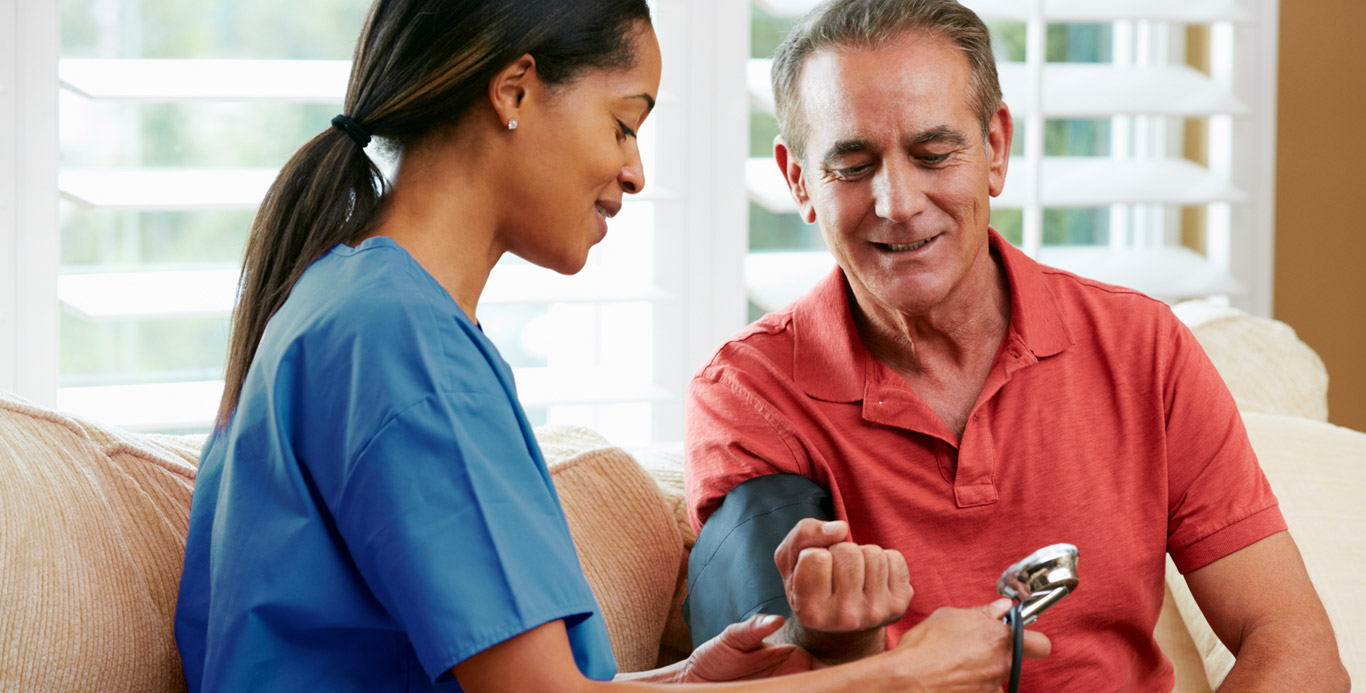 USMM employee taking a patient’s blood pressure