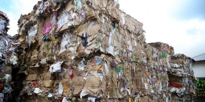 Tonnes of waste paper and cardboard is ready to be shipped for recycling.